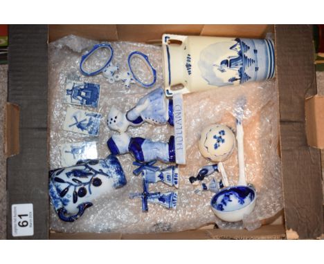 A collection of Delft Pottery items to include two handled vase, egg with lid, miniature windmills and other similar items to