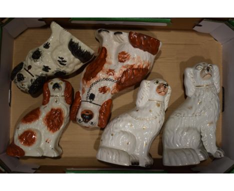 A collection of ceramics to include two pair of Staffordshire Dogs and another single dog.  Generally good with some light we