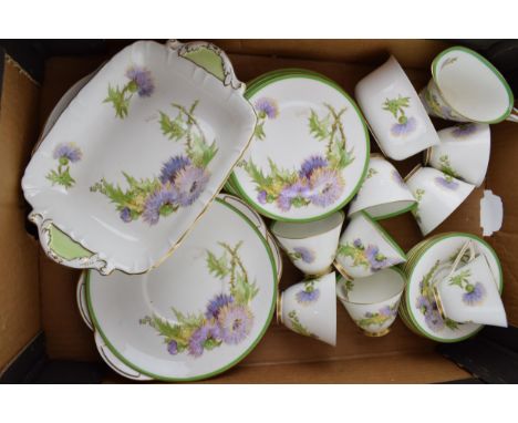 Royal Doulton tea ware in the Glamis Thistle pattern, to include 8 cups, 7 saucers, 8 side plates, 2 cake plates, 2 other dis