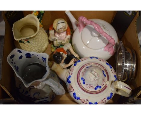 A collection of antique and contemporary ceramic items to include tea pots, Staffordshire figures and a Clarice Cliff, Newpor