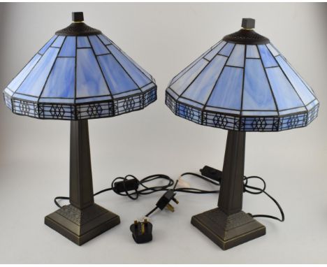 A pair of Art Deco style bead-side lamps with blue glass Tiffany style shades. Modern wiring with switches on cables. Height 