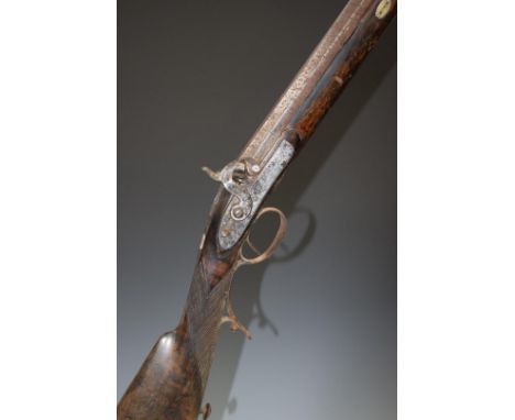 Unnamed percussion hammer action rifle with engraved locks, hammer, scrolling trigger guard and butt plate, brass tipped ram-