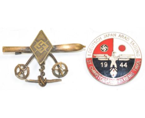 Two German Third Reich Nazi Hitler Youth badges, comprising ski/winter sports with ski poles and ice axe design, with box, an