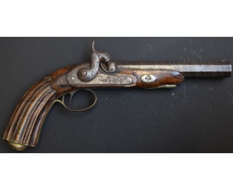 Percussion hammer action pistol with engraved lock, trigger guard, top plate, butt cap and mounts, carved fluted grip and 6 i