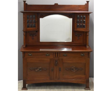 Art Nouveau/ Arts &amp; Crafts mirror back sideboard, the bevelled mirror flanked by bulbous glazed cupboards, the base fitte
