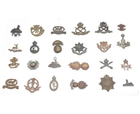 Twenty four British Army officer's collar badges including North Staffordshire Regiment, Northumberland Fusiliers, 20th Hussa