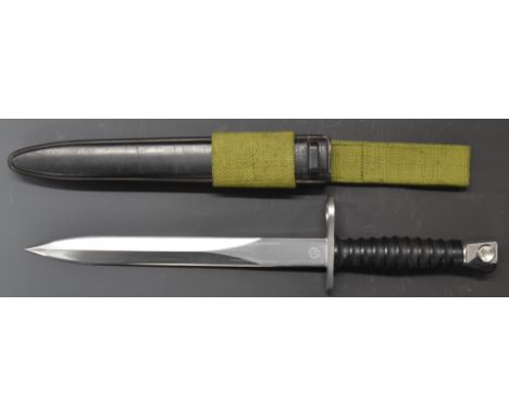 Swiss S.I.G 1957 pattern bayonet with 24cm double edged blade, 477120 and F.W to ricasso, with scabbard and frog.&nbsp;PLEASE