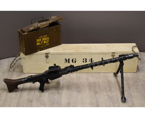 Deactivated German MG34 7.92mm light machine gun with drum magazine, folding bi-pod, top plate stamped 'dfb 42', and adjustab