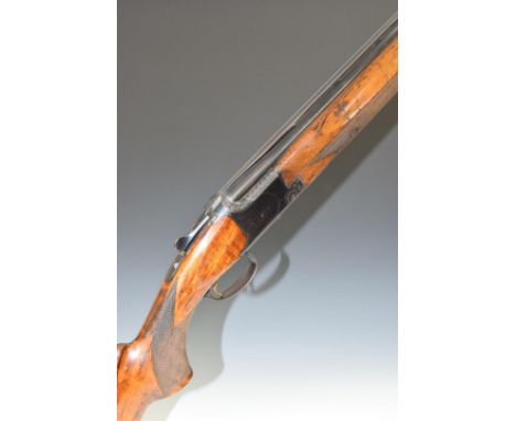 Browning B25 A1 12 bore over and under ejector shotgun with engraved decoration, single trigger, chequered semi-pistol grip a
