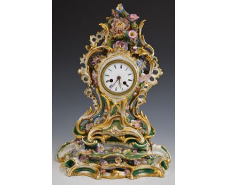 A 19th/20thC continental porcelain flower encrusted mantel clock and stand, H46cm
