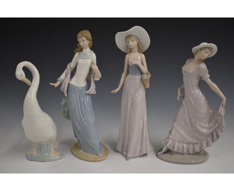 Three Nao figures and a swan, tallest 34cm