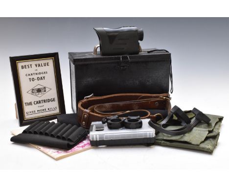 A collection of gun and shooting related items including 6x25 rangefinder etc in a black ammunition tin.&nbsp;