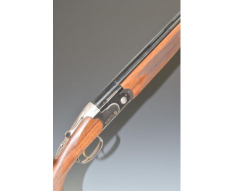 Beretta 686 Onyx 20 bore over and under ejector shotgun with named lock and underside, chequered semi-pistol grip and forend,