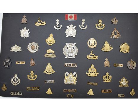 Approximately forty Canadian Army metal badges and insignia including Glengarry Fencibles, Princess Louise Dragoon Guards, Qu