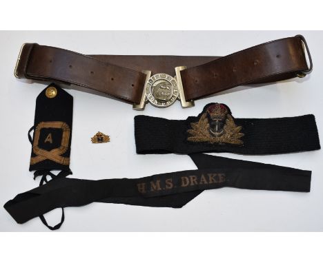 British Army brown leather belt with Dieu et Mon Droit to metal buckle, together with a Royal Navy bullion tally badge, gilt 