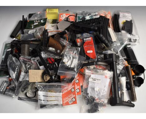 A large collection of shotgun and rifle parts and accessories including Howa trigger guard and magazine housings, sights, sco