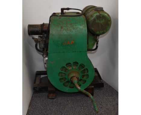 J.A.P model 5 stationary engine which the vendor advises it is in running condition, on four wheel trolley or skate, height 6