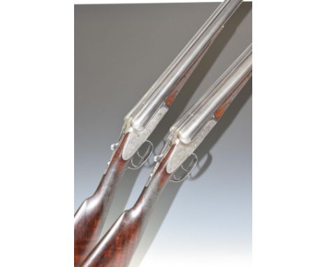 A pair of Cogswell &amp; Harrison Ltd 12 bore side by side ejector shotguns, each with scrolling engraving to the named sidel