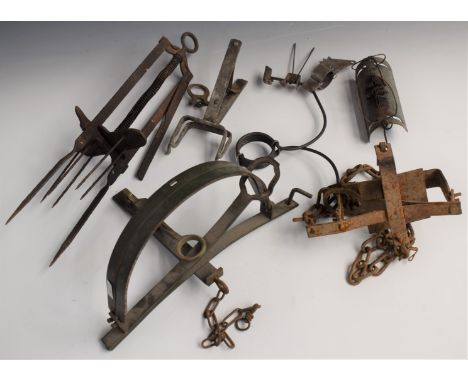Six various vintage animal traps including a mole trap and one stamped 'Gallie Trap 602'.&nbsp;