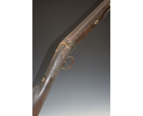 Indistinctly named 10 bore percussion hammer action gun with engraved lock and trigger guard, chequered grip, steel tipped ra