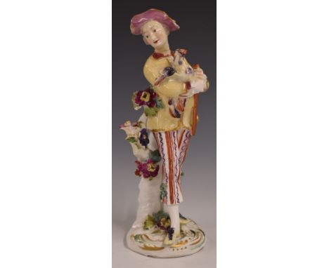 Derby patch period figure of a man holding a cockerel, H21cm