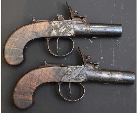 A pair of Clark of London flintlock hammer action pocket pistols each with named and engraved lock, thumb slide safety, shape