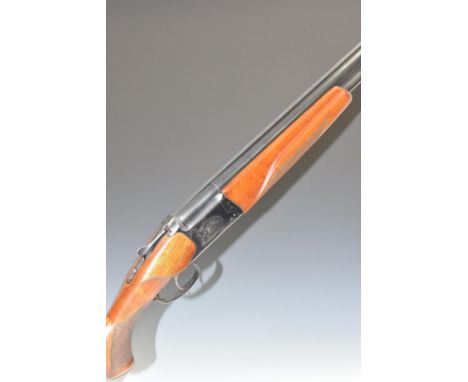 Baikal IJ-27 12 bore over and under shotgun with engraved scenes of birds to the locks, engraved top lever, trigger guard and