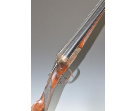 Fabrique Nationale 12 bore side by side shotgun with engraved locks, underside, trigger guard, thumb lever and fences, cheque