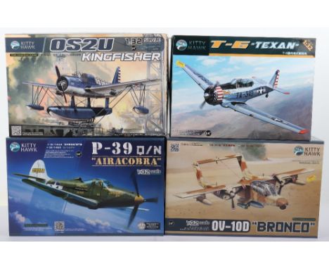 Four Kitty Hawk 1:32 scale Fighter Aircraft model kits, P-39 Q/N ‘Aircobra’ with extra detail up parts, OV-10D ‘Bronco’ with 