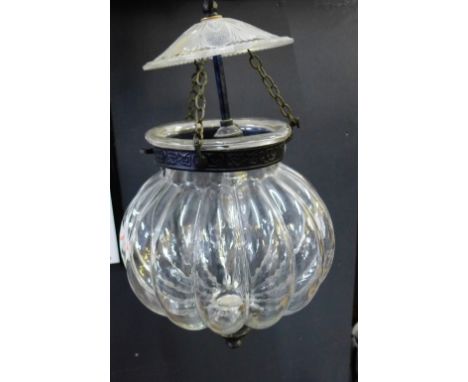 A clear glass hanging light fitting of lobbed circular form with bronzed metal mounts, 40cm