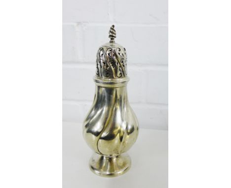 An Edwardian silver castor of spiralling baluster form, with flame finial and domed foot, bearing makers marks for Ducrow & A