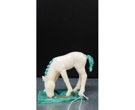 A Goldscheider Austrian white glazed horse on a rectangular green base, 11cm high