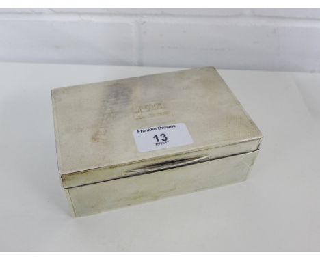 George V silver cigarette box with engine turned decoration and hinged lid with a cedar lining, bearing makers marks for Gold