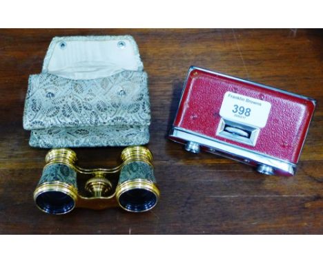 A pair of vintage red leather and chrome Pamex opera glasses together with another pair (2) 