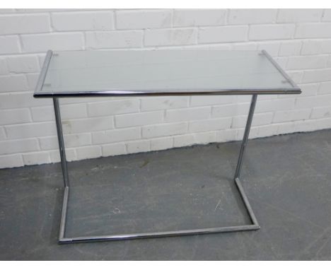 A contemporary opaque glass and tubular metal sofa table, 64 x 76cm