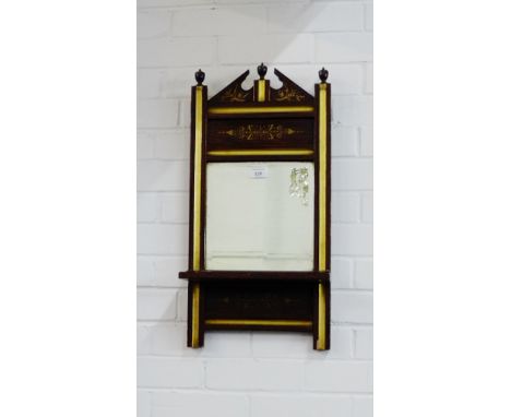 Simulated rosewood and parcel gilt wall mirror, with architectural top and urn finials, with a rectangular plate over a singl