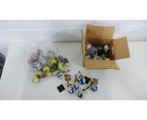 A quantity of coloured ceramic handles (a lot) 