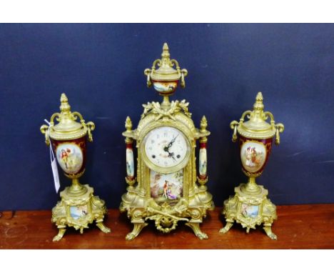 A gilt metal and faux ceramic clock garniture in the Rococo style, 42cm high (3) 