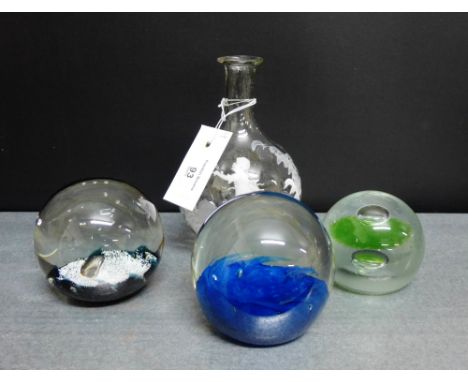 A glass carafe with white enamel Mary Gregory style decoration together with a group of two Caithness glass paperweights and 