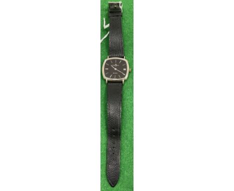 A Baume et Mercier Baumatic gentleman's wristwatch, white gold cased with black shaped rectangular dial, plain batons and dat