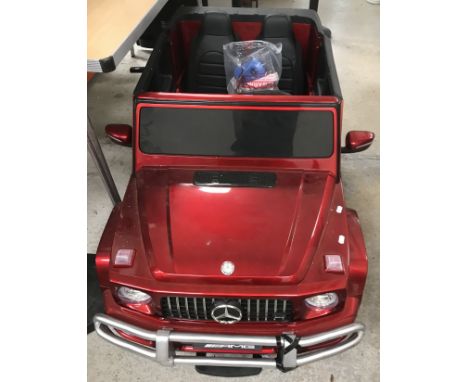 A child's battery operated car "Mercedes AMG G63" with owner's manual, 135 cm long x 72 cm wide x 63 cm high