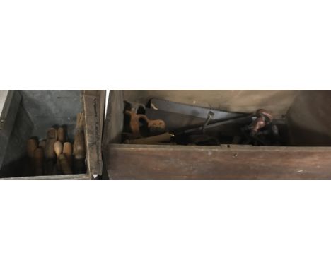A wooden box of various hand tools, woodworking tools, etc. including three various draw knives, three large saws, two roofin