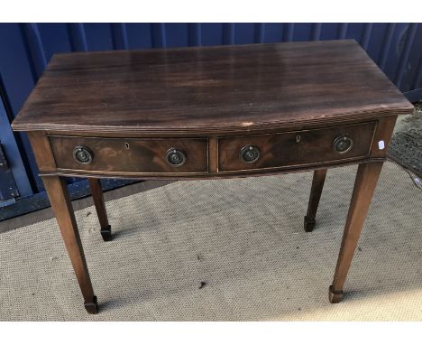 A carved oak bench in the 17th Century manner, the single plank seat flanked by two carved pew ends, with foliate and floral 
