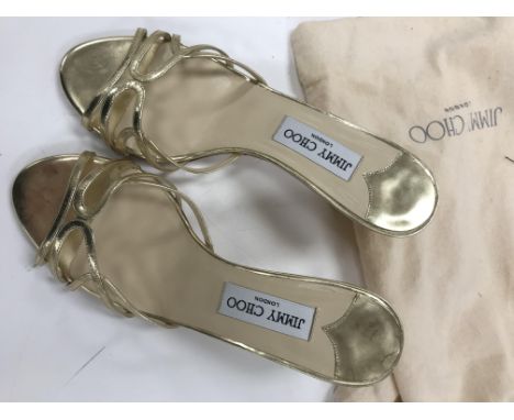 A pair of Jimmy Choo of London strapped evening shoes in gold leather, size 38, in bag, a Kate Spade taupe handbag with handl