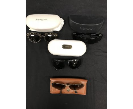 A box containing four pairs of sunglasses: Yves St. Laurent, Chloe, Rayban and Blinde, together with seven leather belts to i