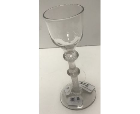 An 18th Century wine glass with plain ogee bowl on a double knop enamel twist stem and circular foot, 15.5 cm high   CONDITIO