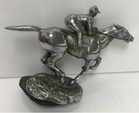 A Desmo chromed car mascot in the form of a racehorse and jockey, stamped "Copyright Desmo", 11 cm excluding screw fitting x 