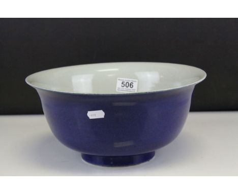 A Chinese ceramic bowl decorated with man in costume to interior, marked to underside with double blue ring and character mar