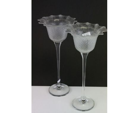 A pair of hobnail glass candle holders with long stems raised on a circular base together with a Ornate Brass Cased Mantle Cl