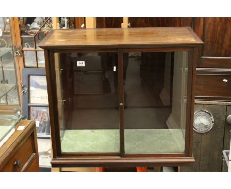 Early 20th century Mahogany Cased Display Cabinet with two sliding glass doors opening to two glass shelves (one glass panel 